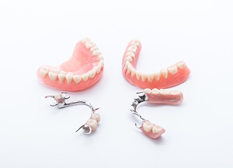 Full and partial dentures arranged against white background