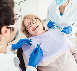 Senior woman smiling at dentist