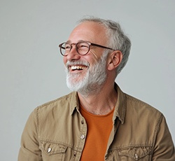 Man with glasses smiling